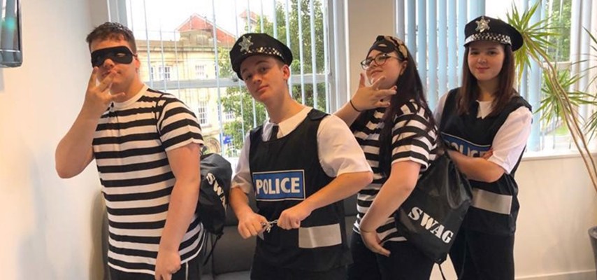 Bury College A-level Drama students dressed as cops and robbers
