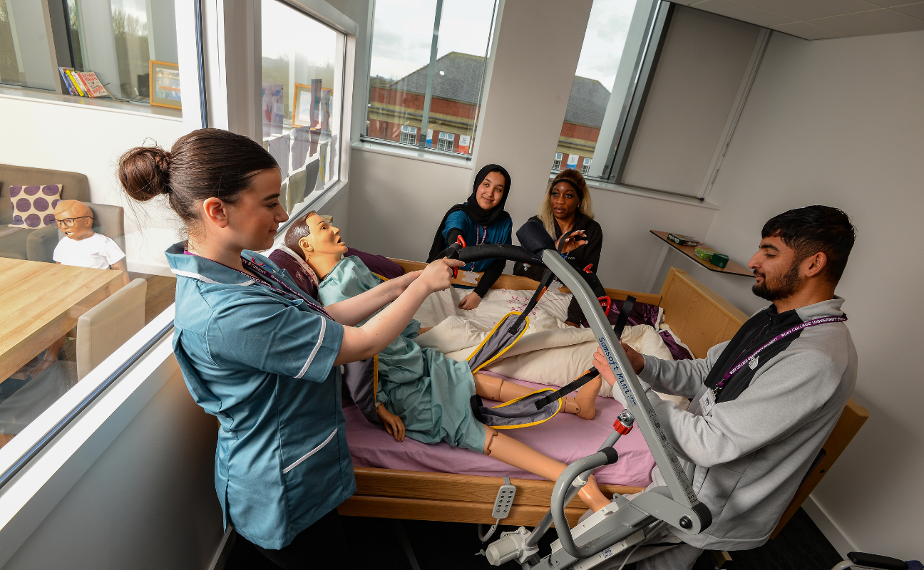 Health and social university centre students taking part in a practical session