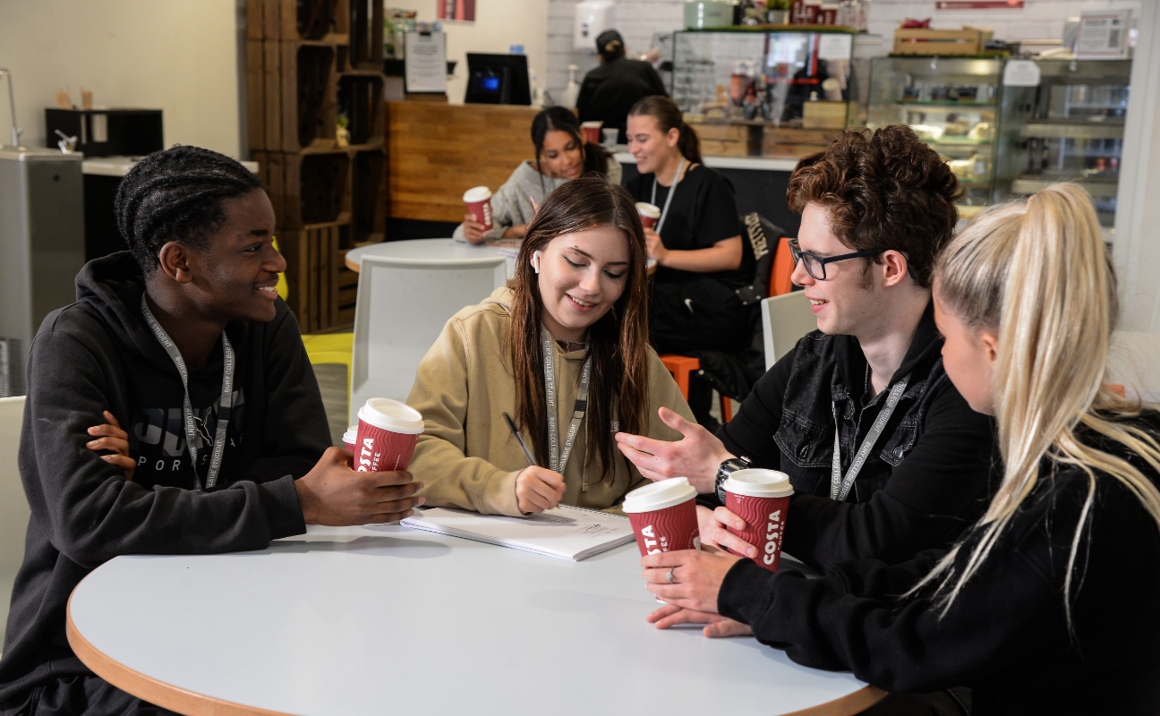students sat in a canteen space socialising