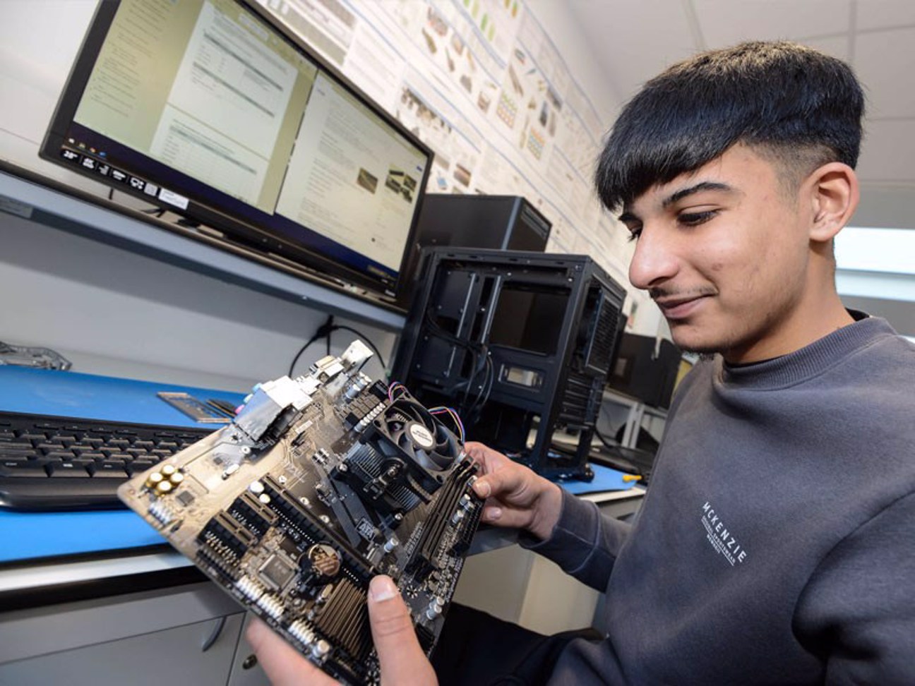 Student looking at a motherboard