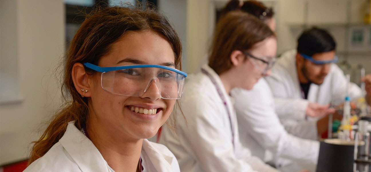 Student smiling in science