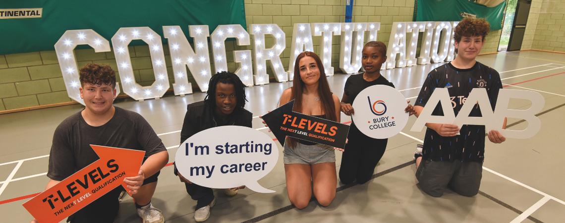 a row of students in front of a congratulations sign