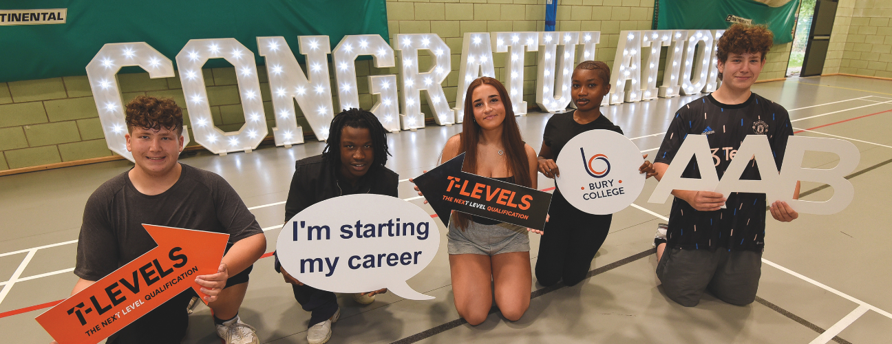 a row of students in front of a congratulations sign