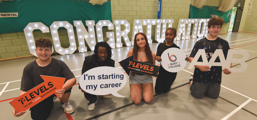 a row of students in front of a congratulations sign
