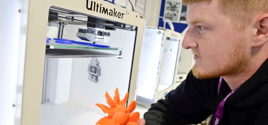 Engineering student with a 3d printer