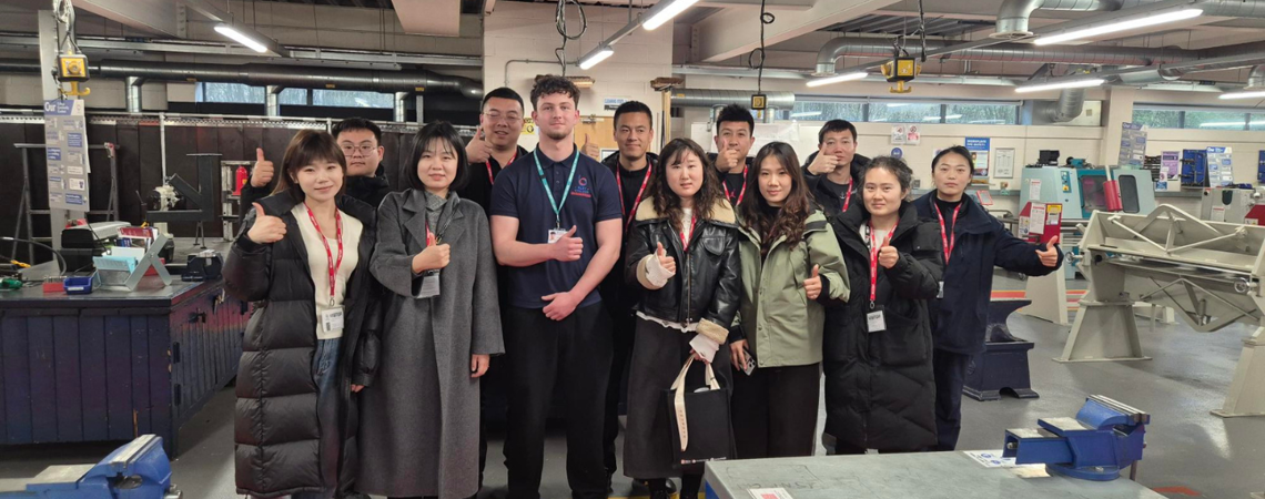 a row of Chinese delegacy students visiting Bury College