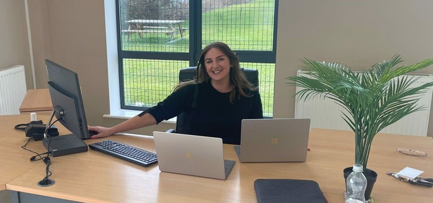 A former Bury College University student sat behind a desk