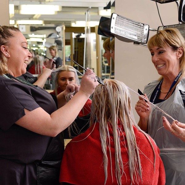 Hairdresser cutting hair