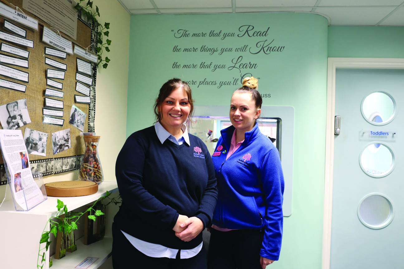 two people stood in a classroom