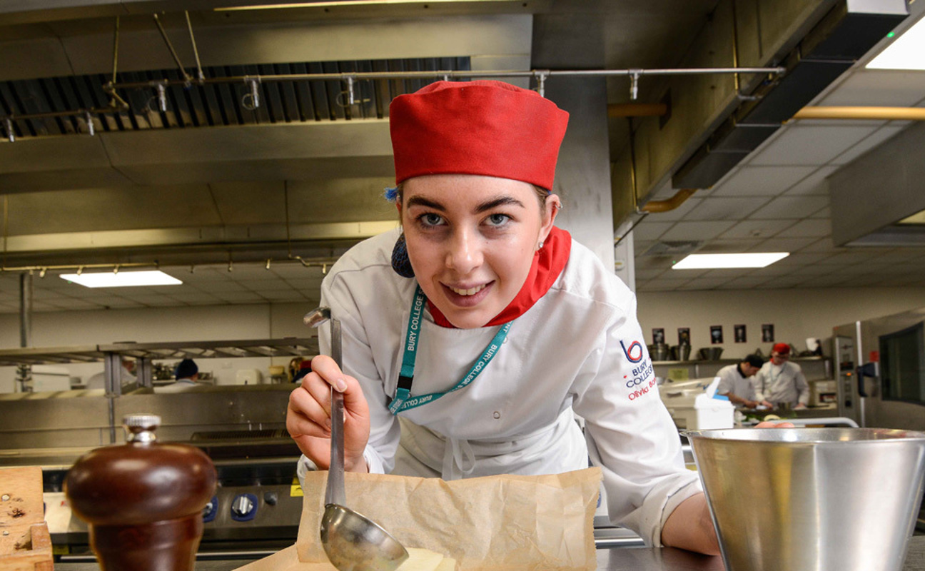 Catering student preparing food in the kitchen