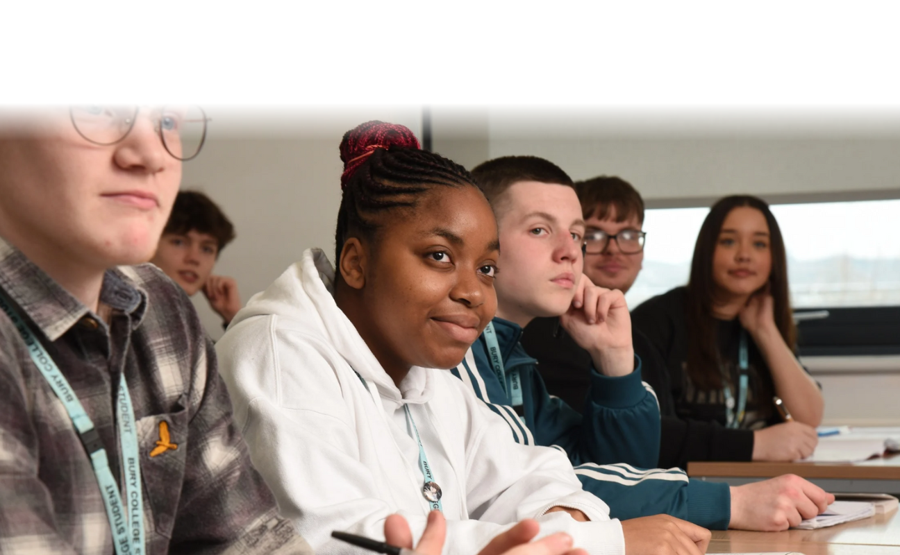 a row of students sat in a classroom