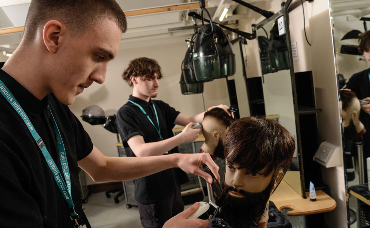 Barbering students working in the hair salon