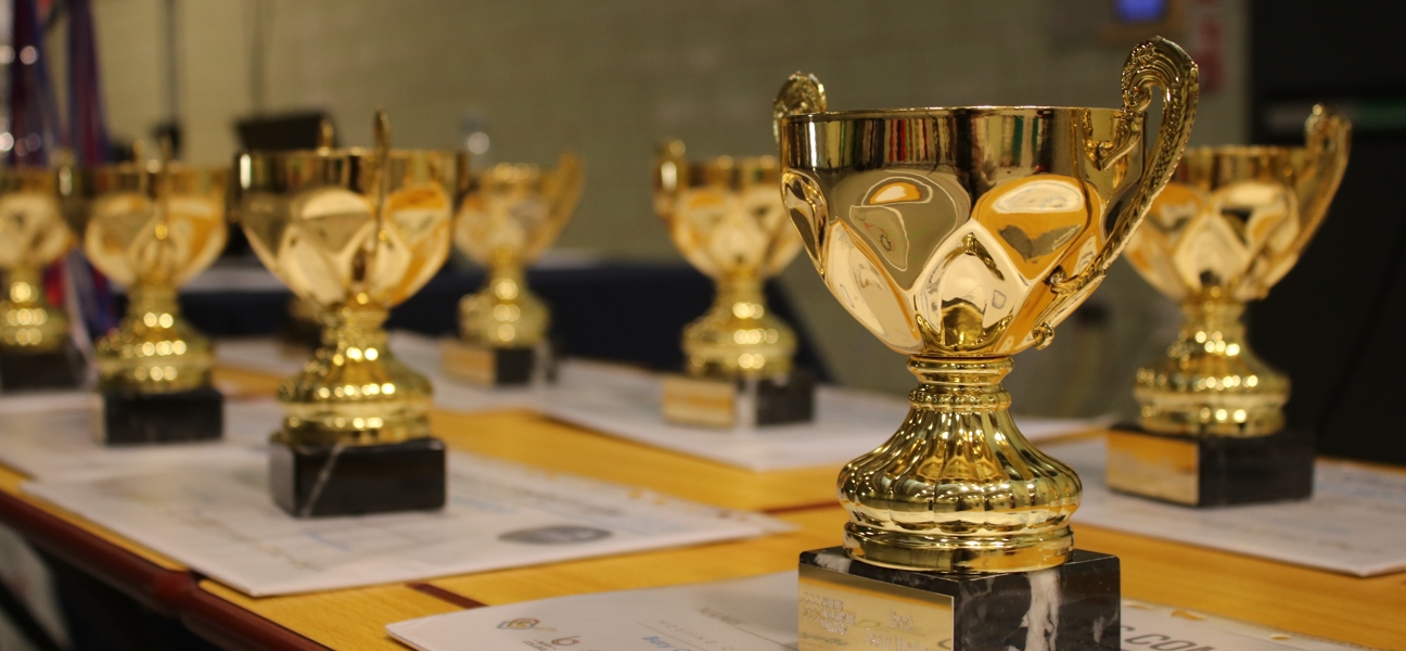trophies and certificates on a table