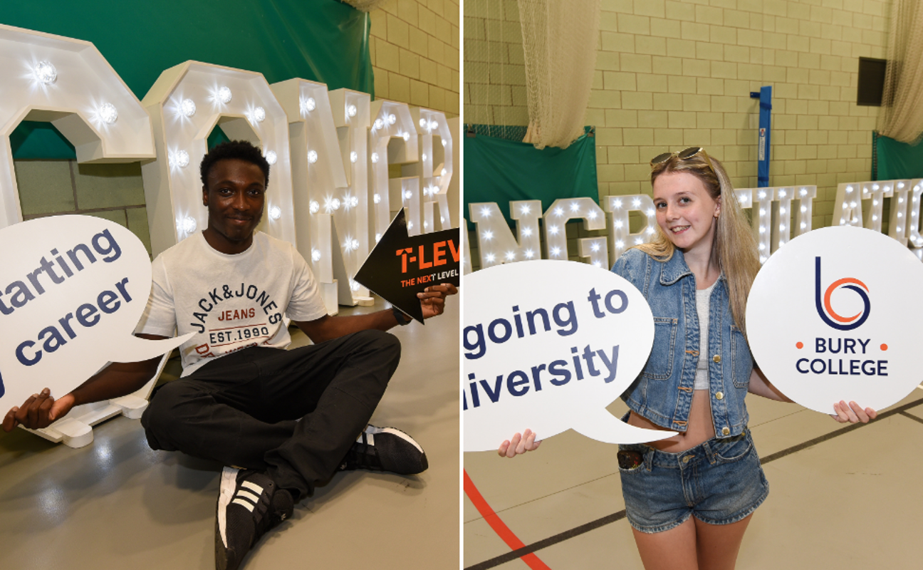 two students sat holding signs whilst celebrating on results day