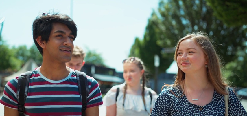 Four Bury College Performing Arts students walking in a still from a short film about COVID-19 safety measures