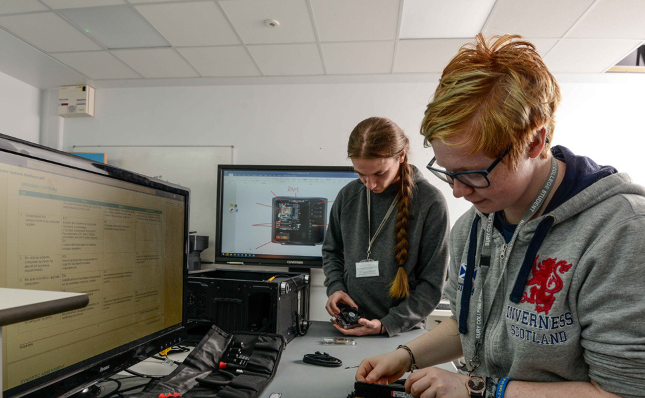 Two IT students working in an PC testing laboratory