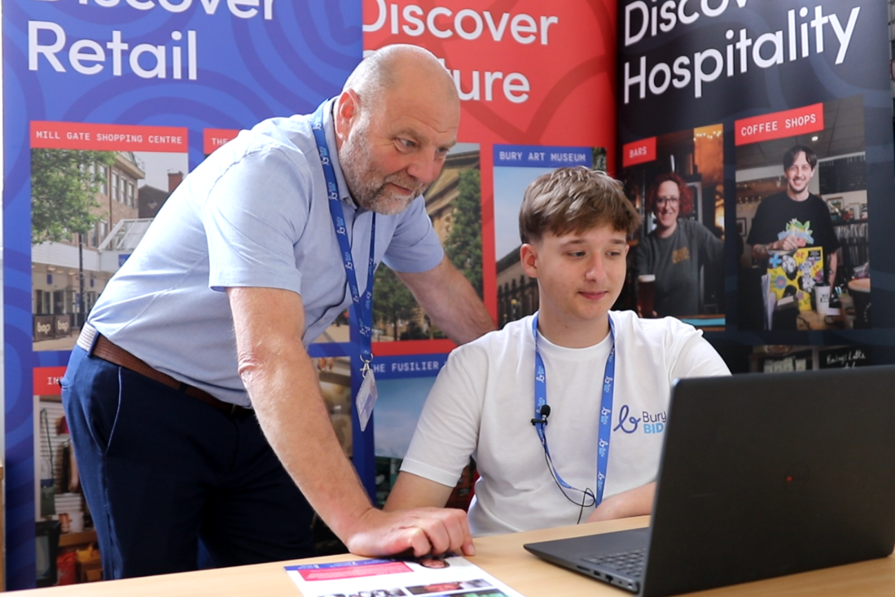 Cameron Taylor and Nigel Shields working in the office