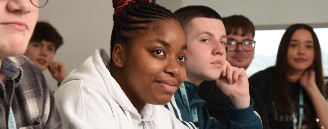 a row of students sat in a classroom