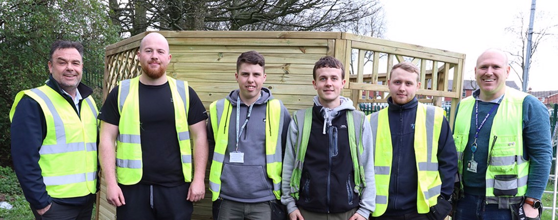 A group of Joinery Apprentices stood on site