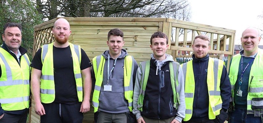 A group of Joinery Apprentices stood on site