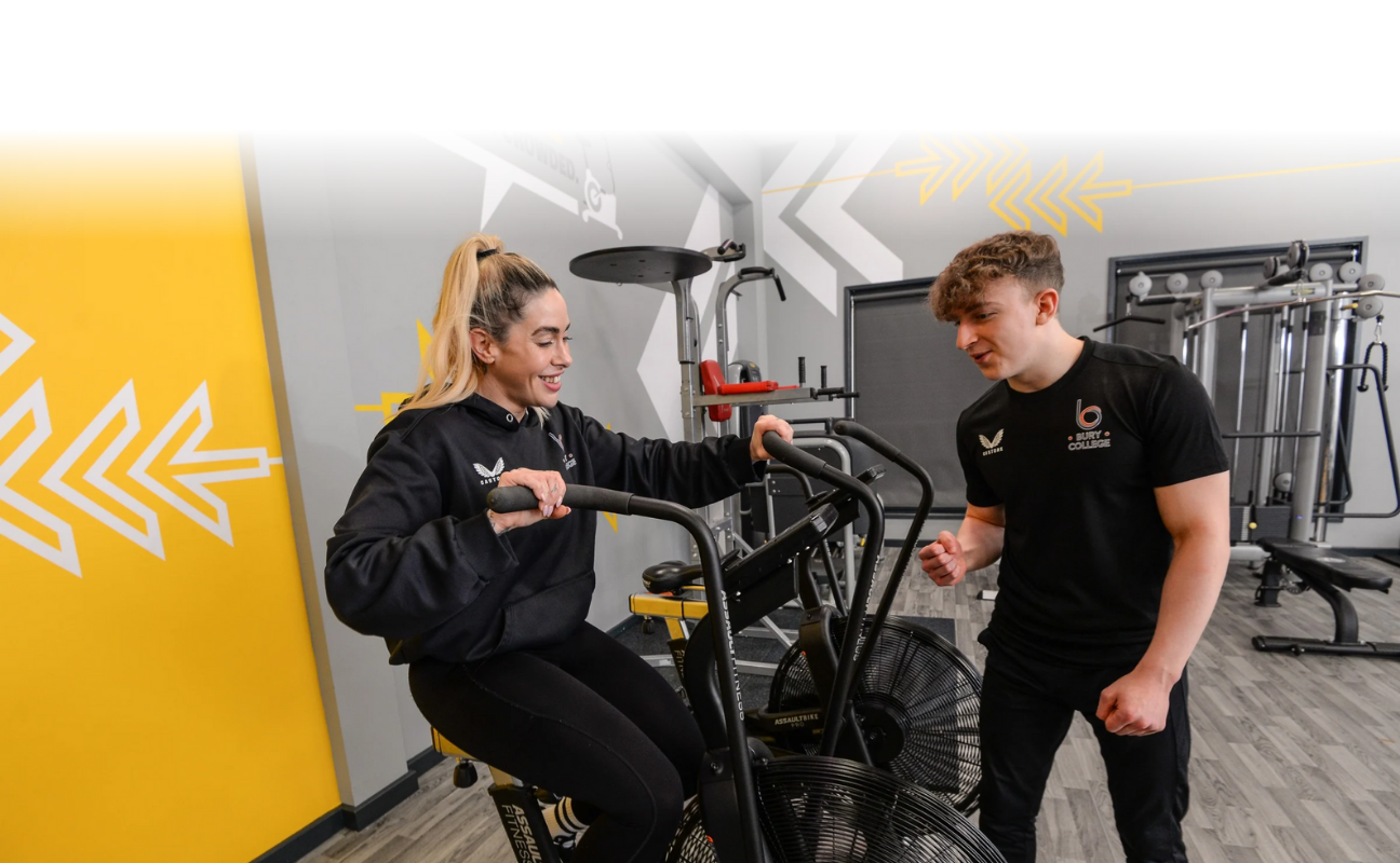 Adult learners taking part in a practical activity in the gym