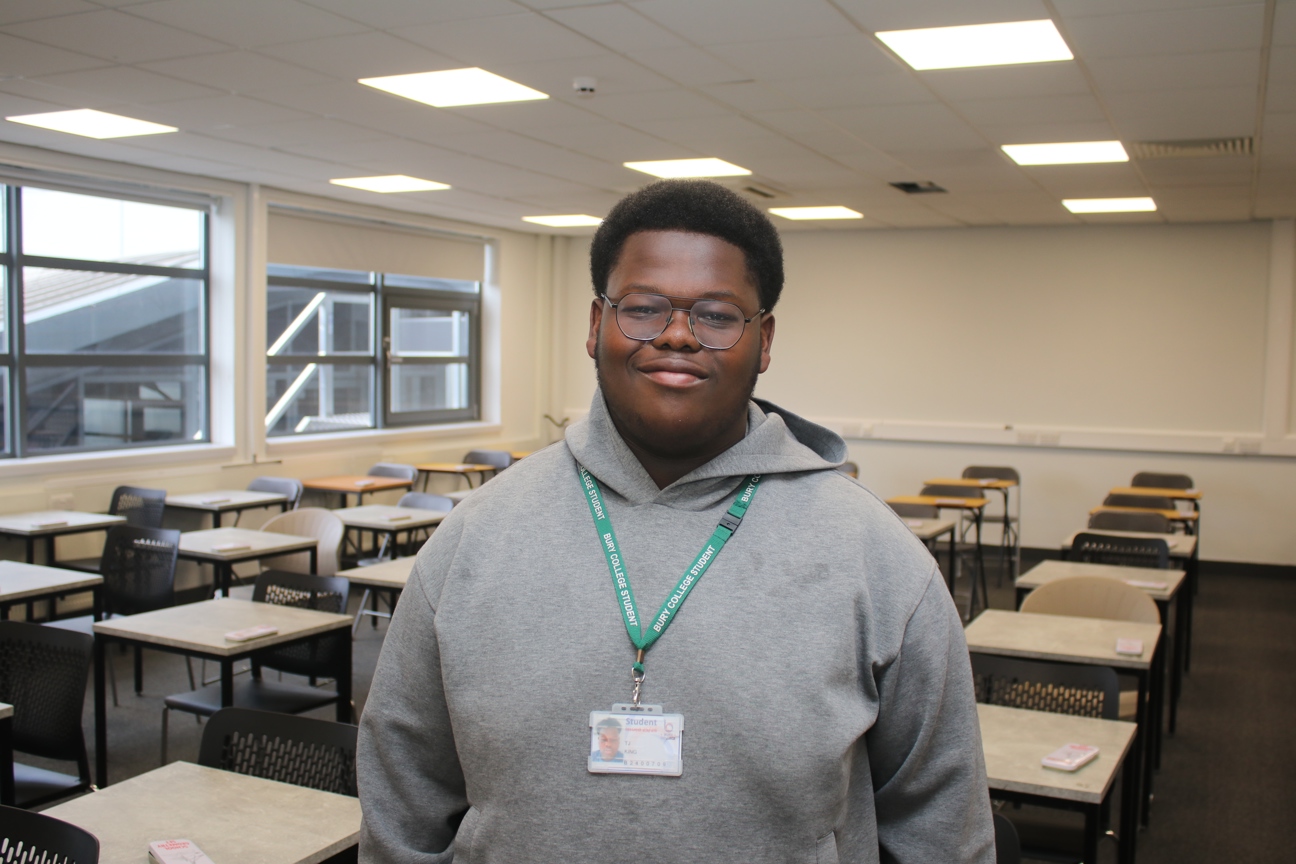 student stood in a classroom