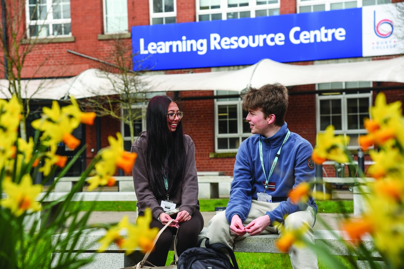 students sat in Woodbury courtyard garden
