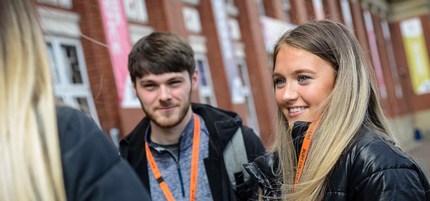 A group of Bury College students wearing orange lanyards
