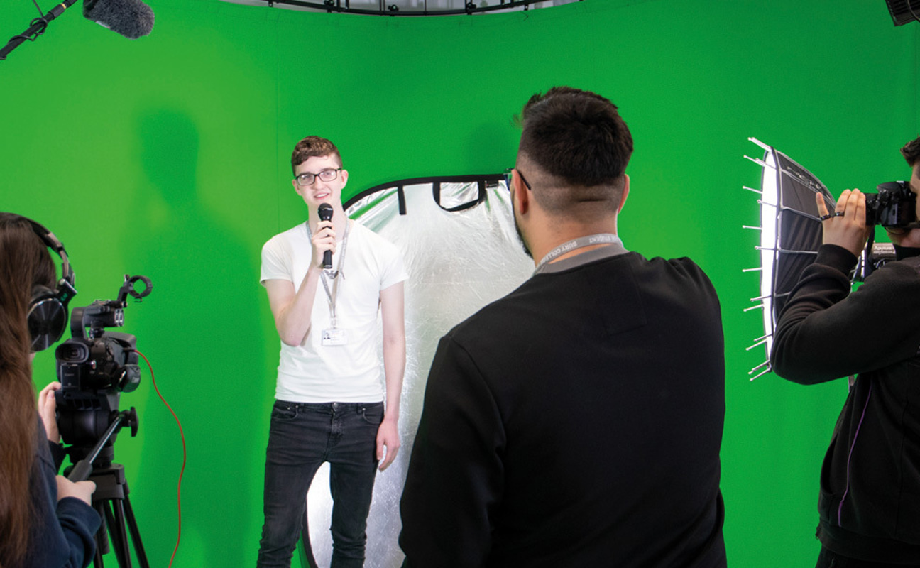 Media students working in the green screen recording studio