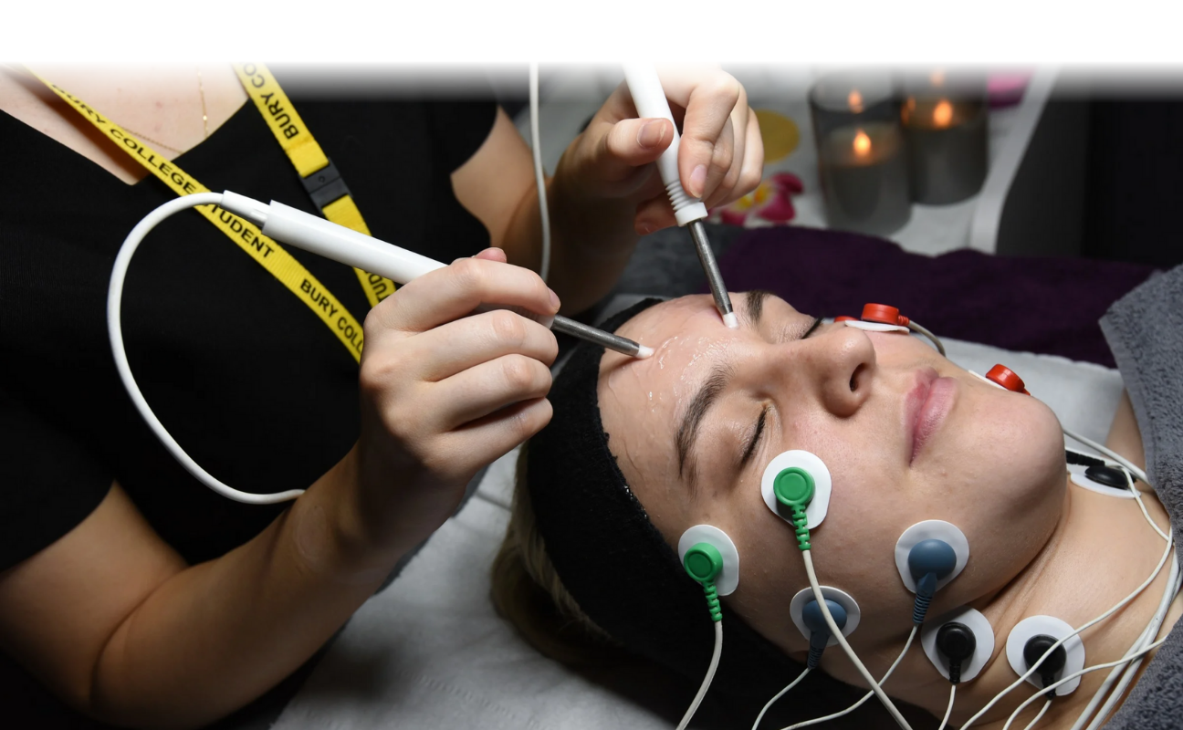 beauty therapy student giving someone electrical facial treatment