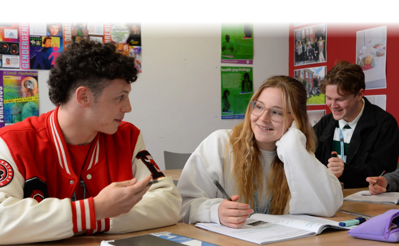 two students in a classroom working together