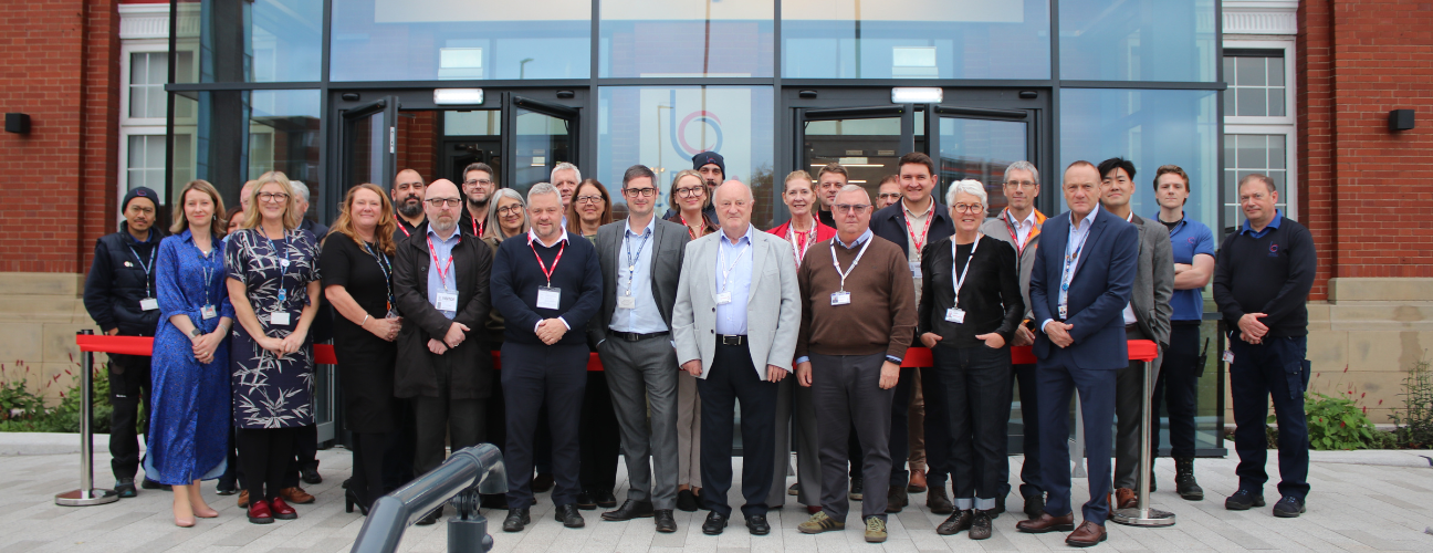 Bury College members of staff and governors stood outside Woodbury building entrance