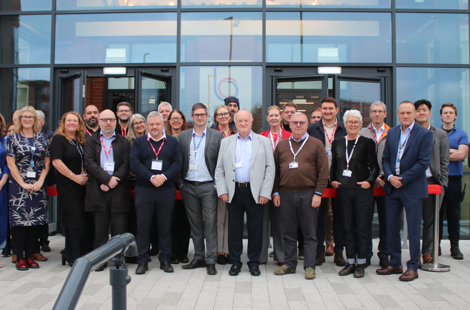 Bury College members of staff and governors stood outside Woodbury building entrance