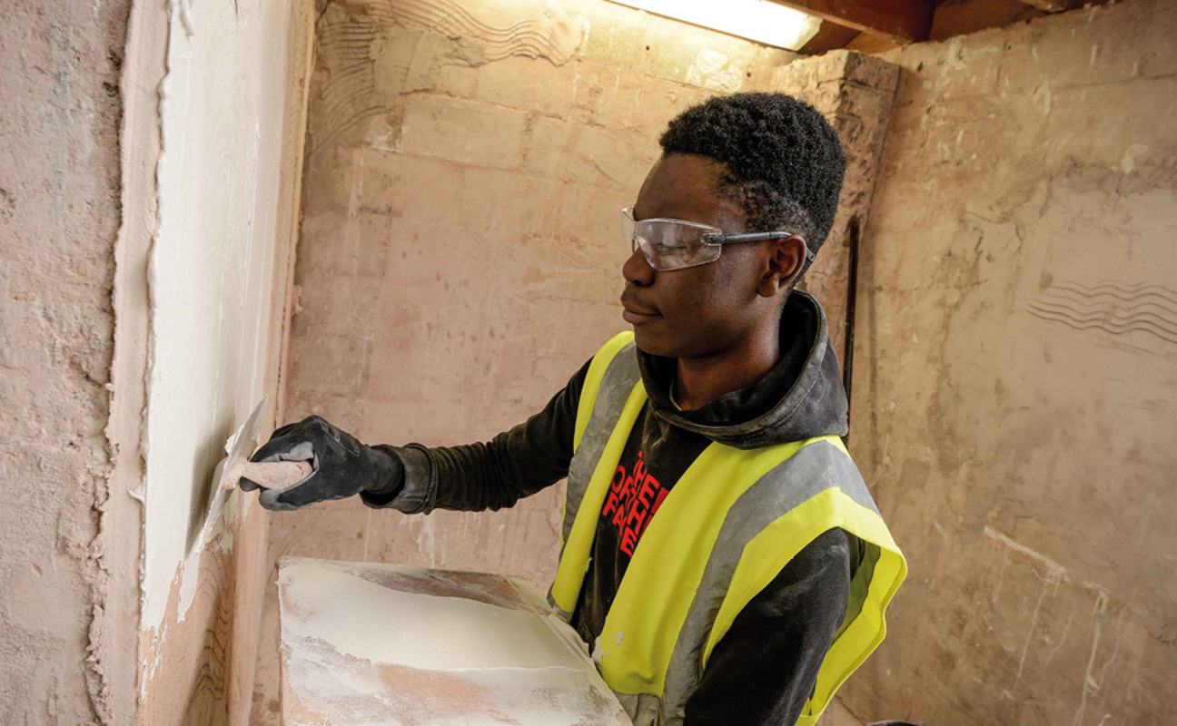 Plastering student in the workshop