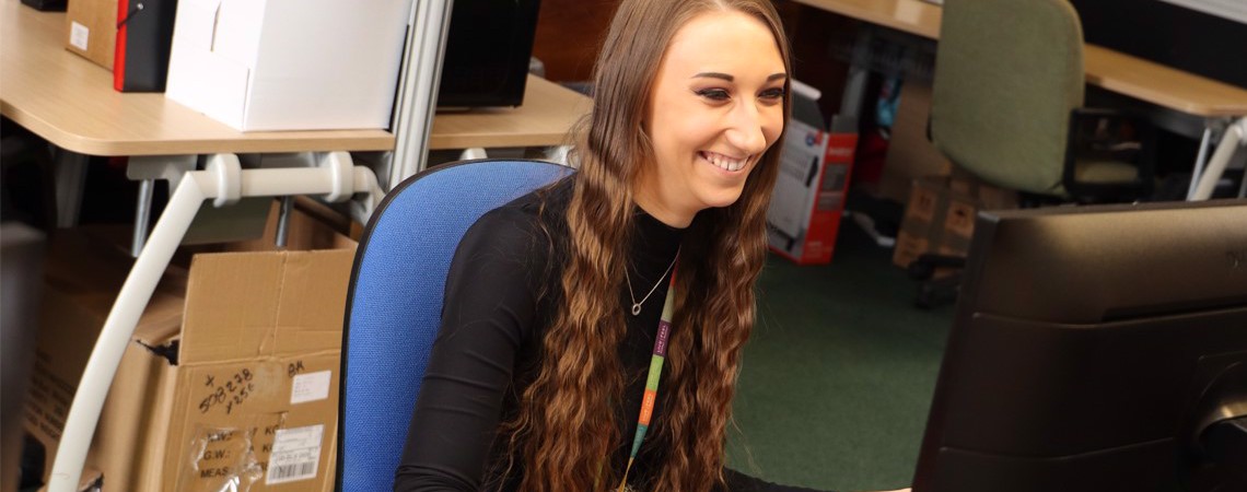 Bury Council Social Media enthusiast, Shannon Wood sat at a desk