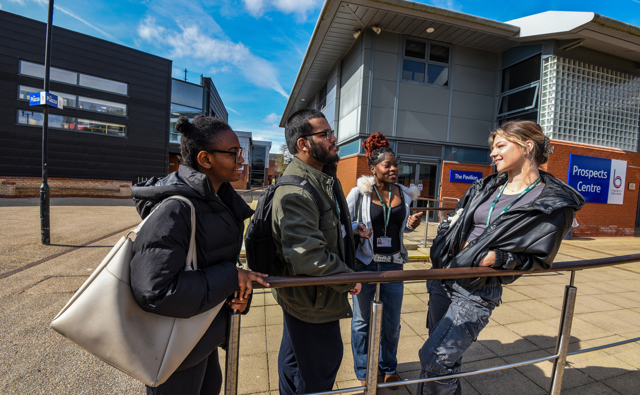 a group of students stood talking
