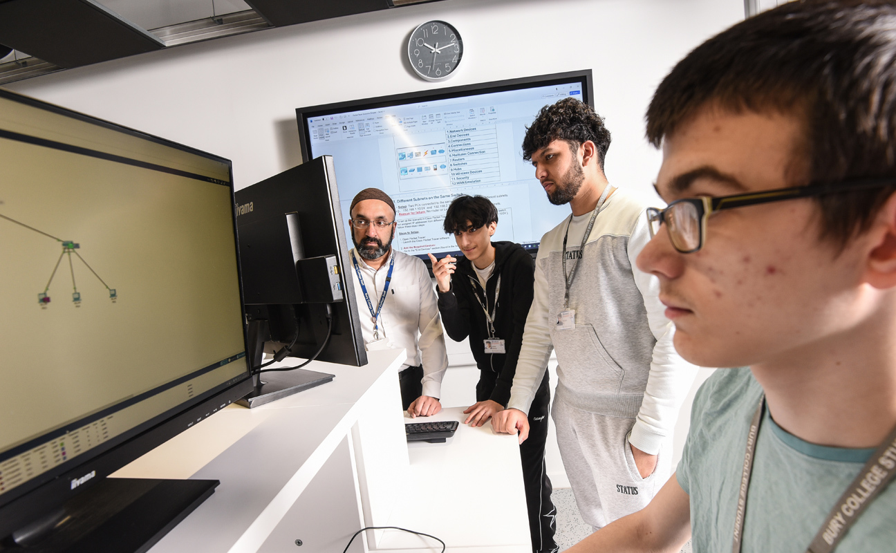 Computing students working in an IT suite