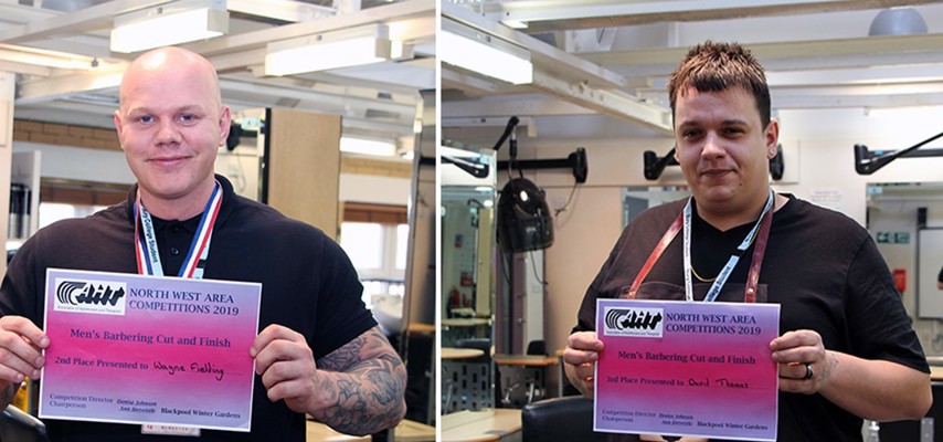 Two students holding their 2nd and 3rd place North West Competitions 2019 certificates