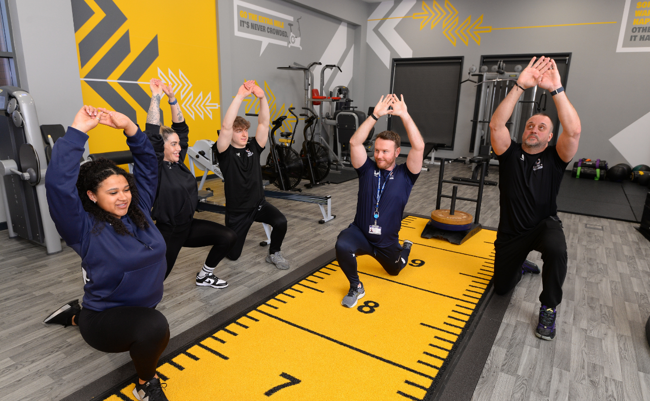 Bury College sport adult learners doing a practical activity in the gym