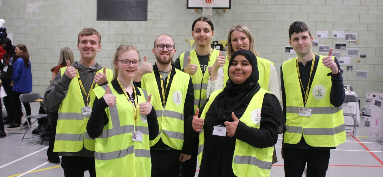 a group of foundation learners in hi vis jackets