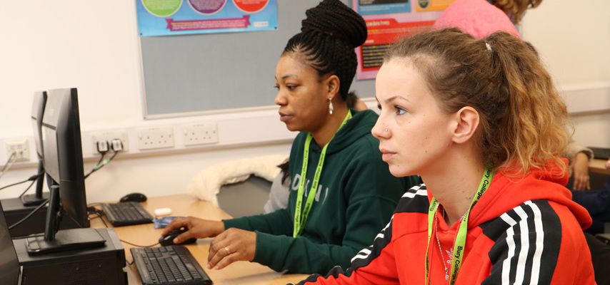 Two students working on a computer