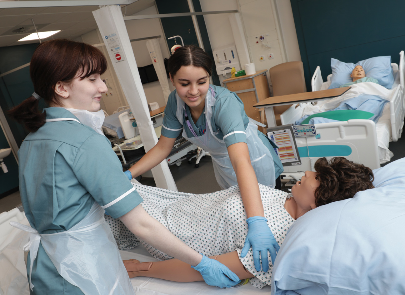 Healthcare students working in the mock ward