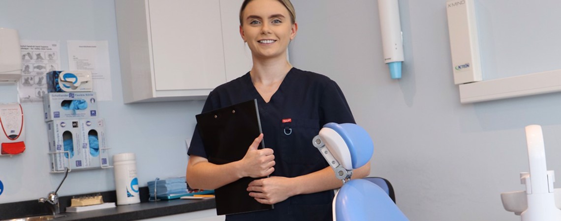 Dental Nursing student, Mia Carswell, in a dental surgery