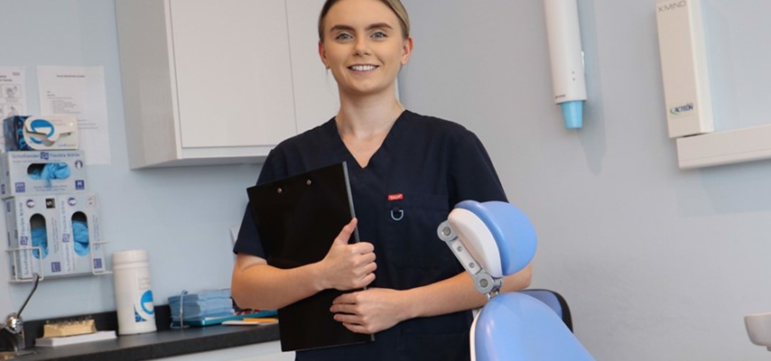 Dental Nursing student, Mia Carswell, in a dental surgery