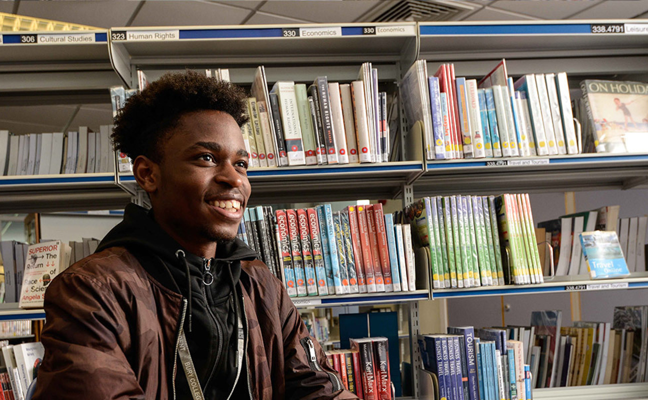 Student smiling in the library