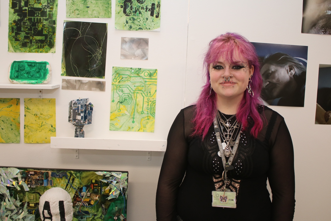 an art student stood in front of their art