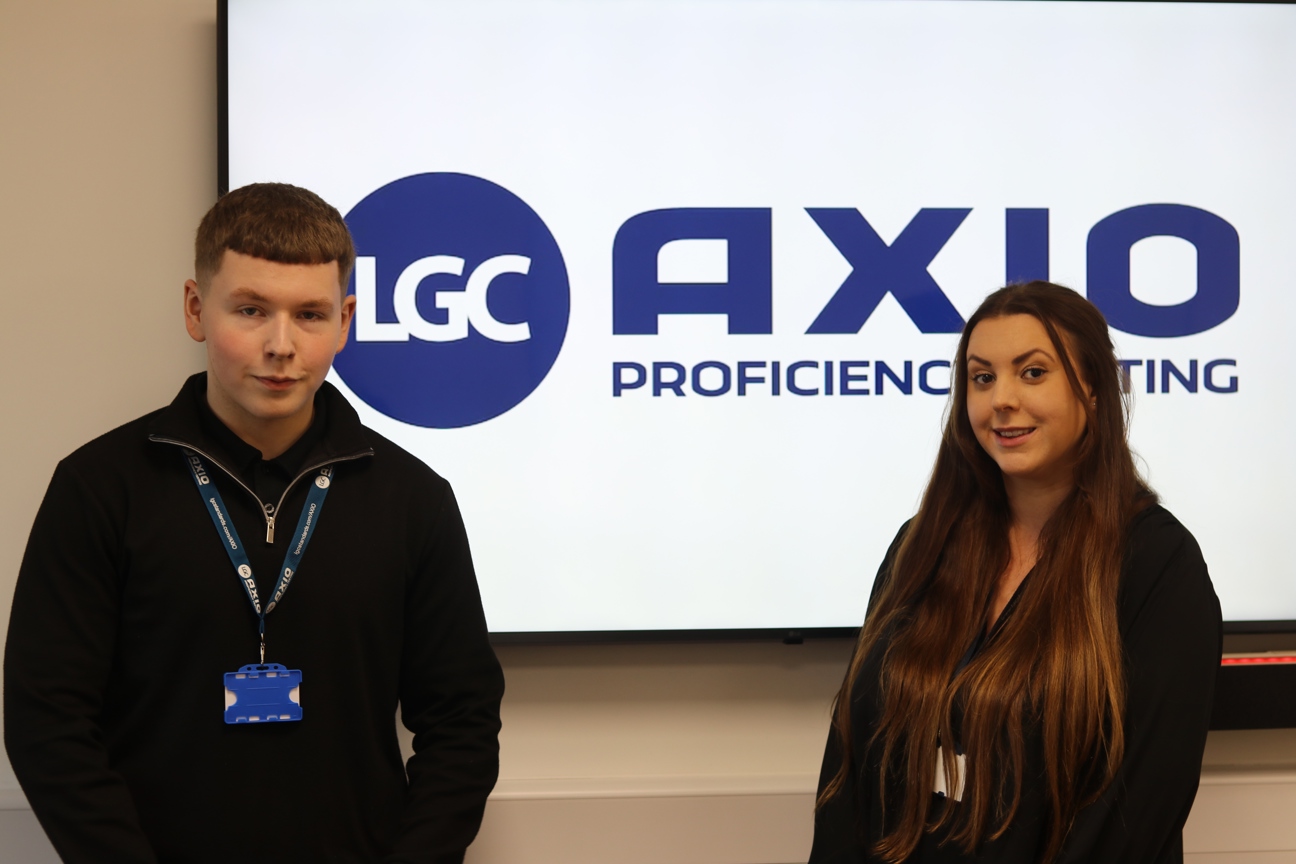 Carson Hamer and Cerys Waywell stood in front of LGC logo