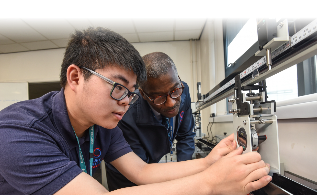 an engineering student in the classroom with a teacher