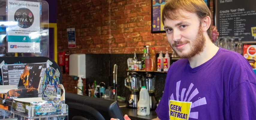 A Bury College Foundation Studies student working at Geek Retreat in Bury