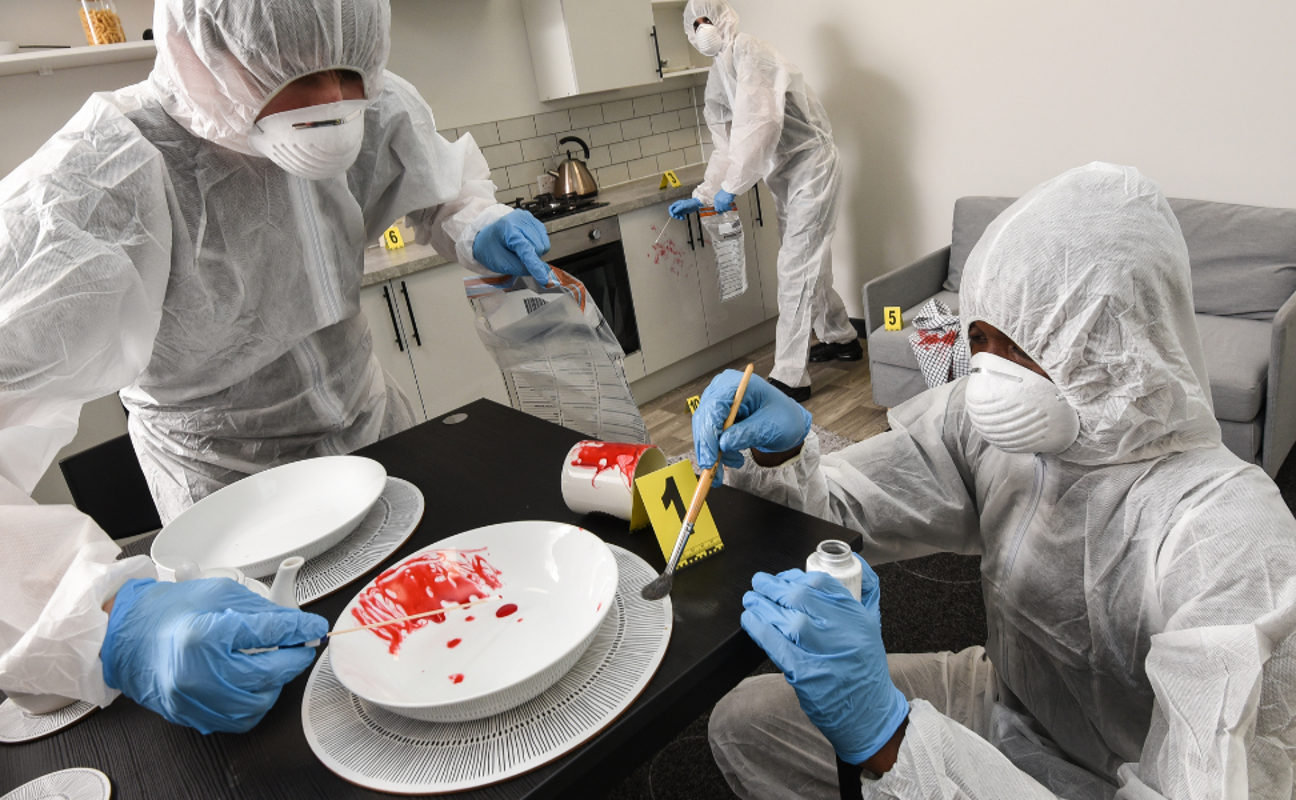 students in a forensics lab inspecting something